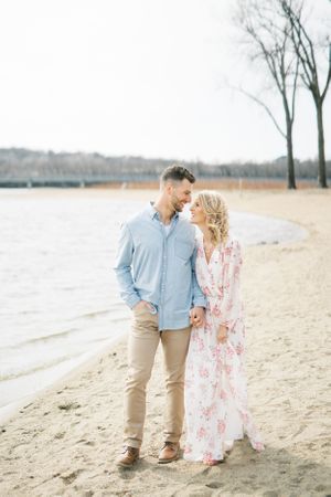 Light and airy film lakeside dock engagement session at Gray's Lake in Des Moines, Iowa