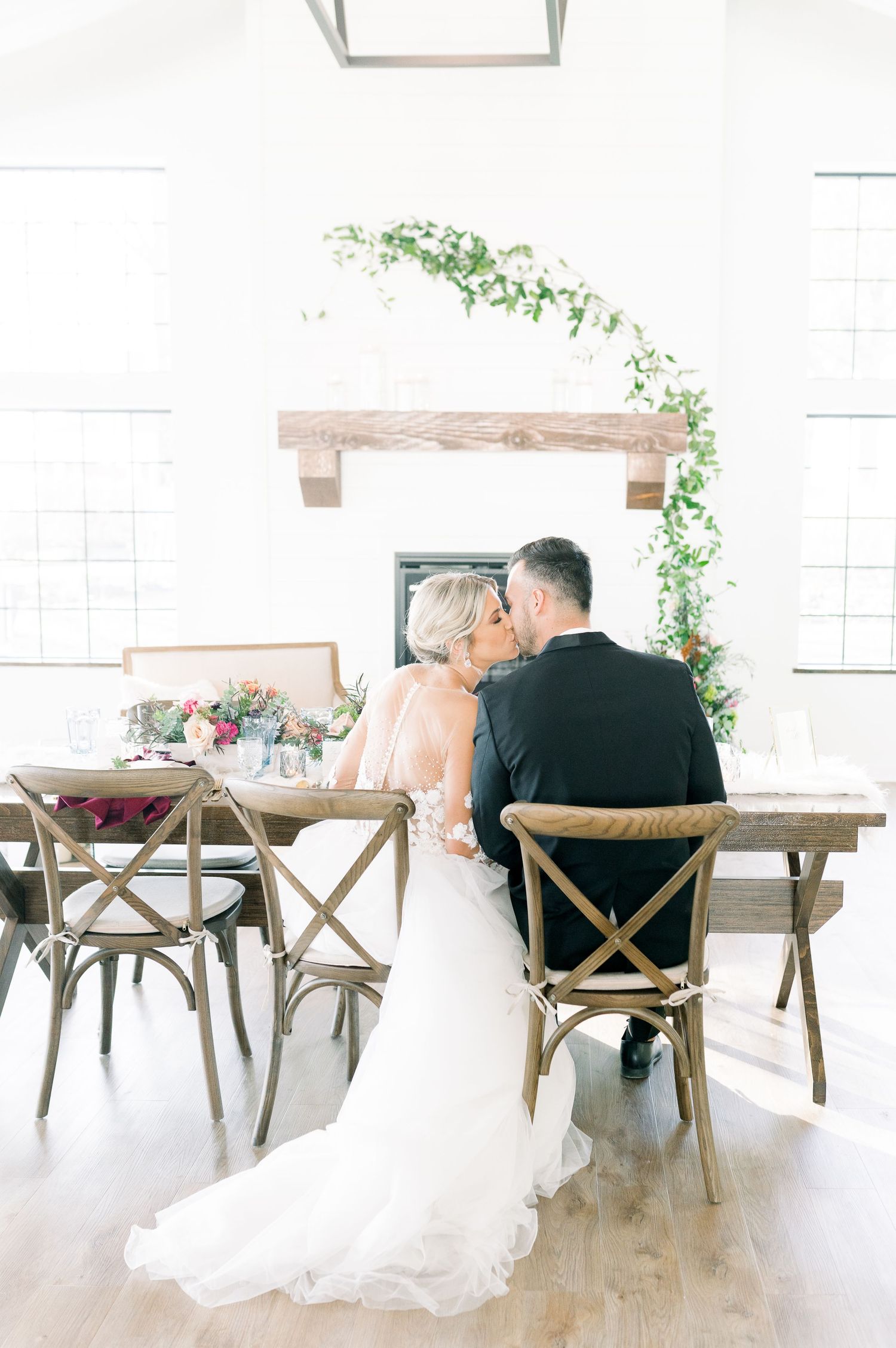 Light and airy 1868 Farmhouse Wedding in Boone, Iowa with farmhouse tables and vowed vintage decor