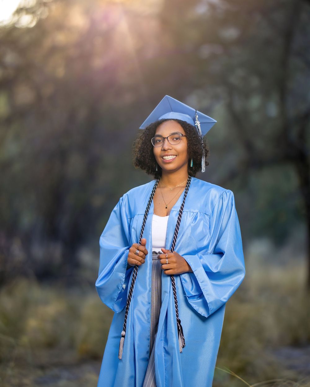 Marlee among pine trees during senior session in Mount Lemmon. Tucson, AZ senior portraits