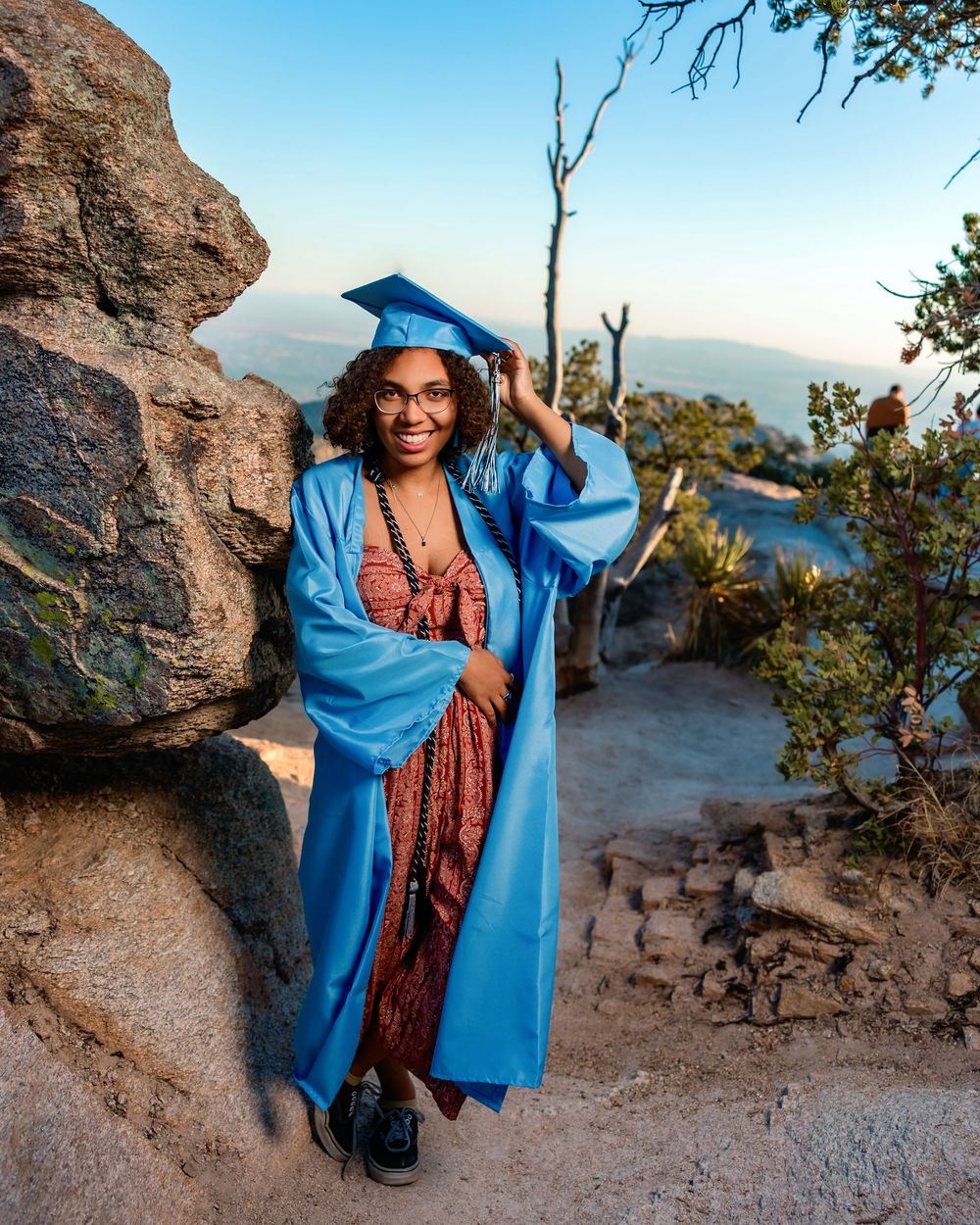 Golden hour senior photo overlooking cliffs at Windy Point, Tucson