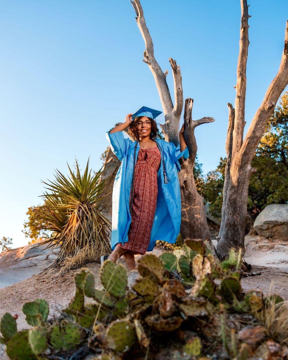 Golden hour senior photo overlooking cliffs at Windy Point, Tucson