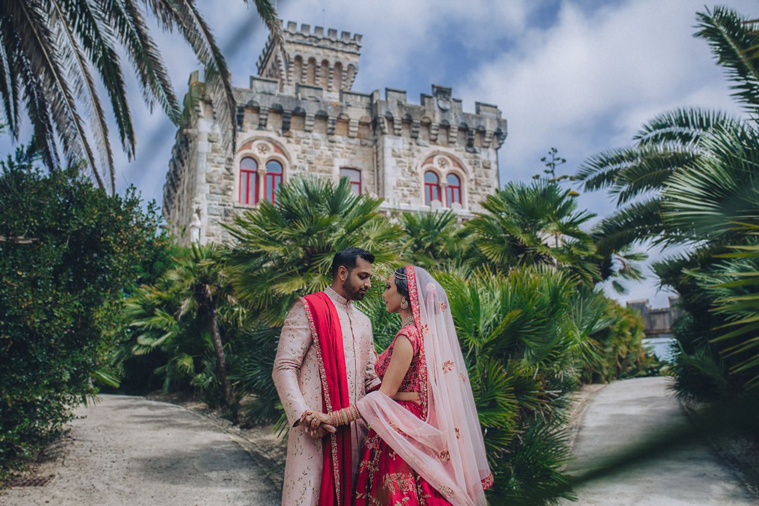 A romantic moment between the bride and groom during their Indian Destination Wedding in Portugal at Forte da Cruz
