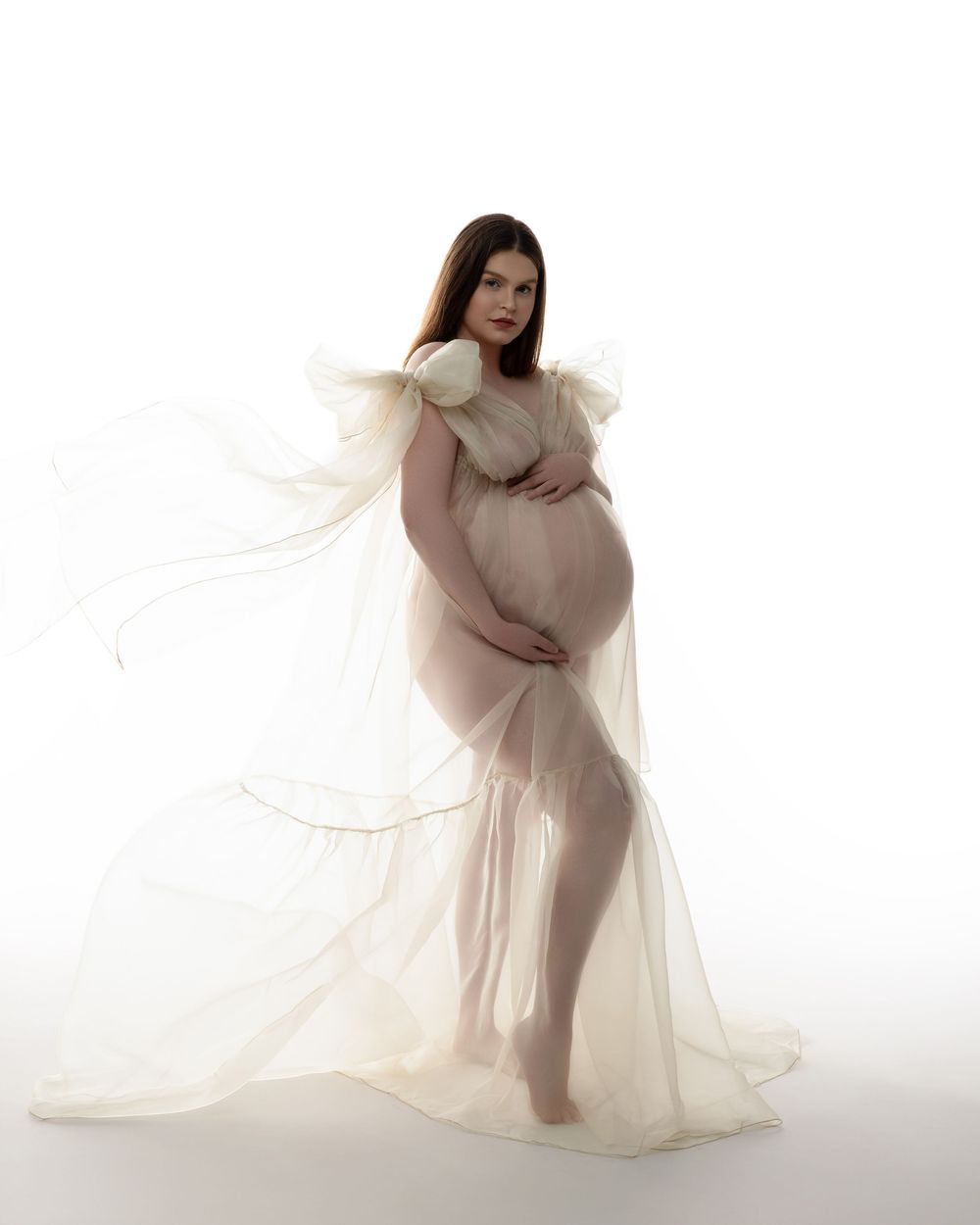 Two figures in soft pink dresses pose gracefully in an ethereal portrait photoshoot sequence.