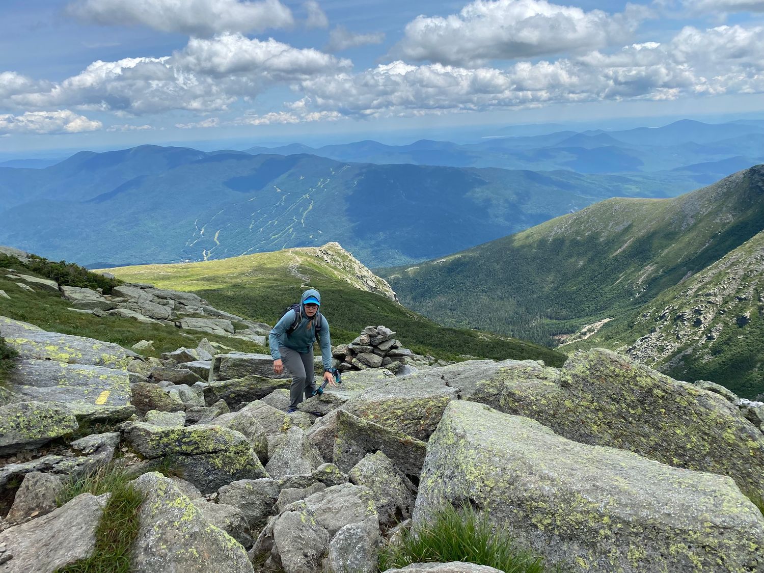 Picture of a woman hiking up a rocky slope