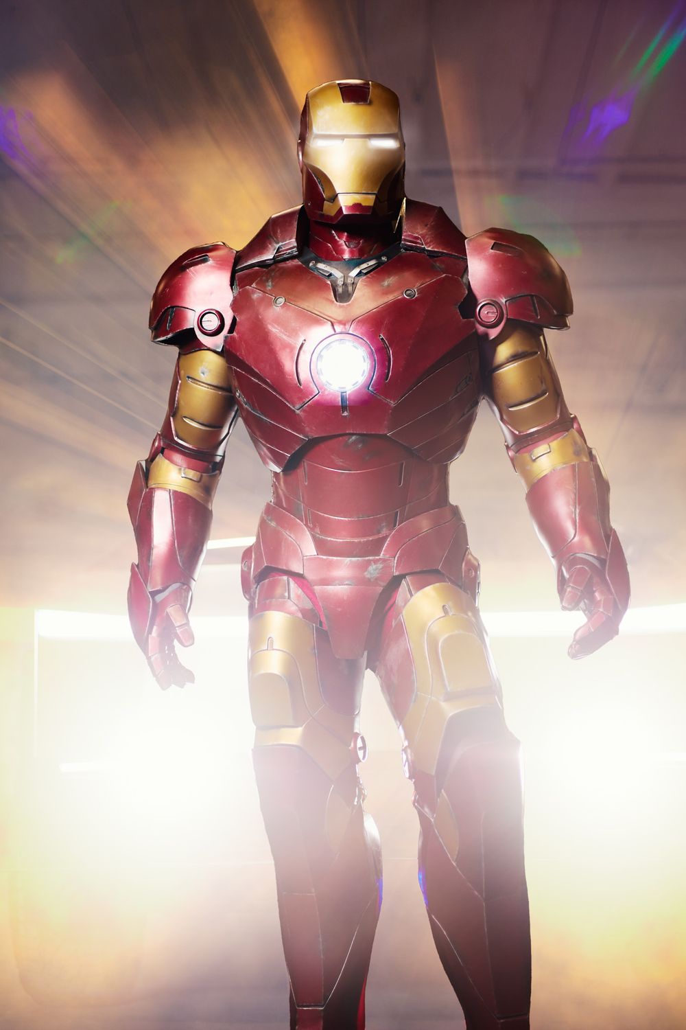 Iron Man armor glows with dramatic backlighting in a series of progressive shots showing the iconic suit design.