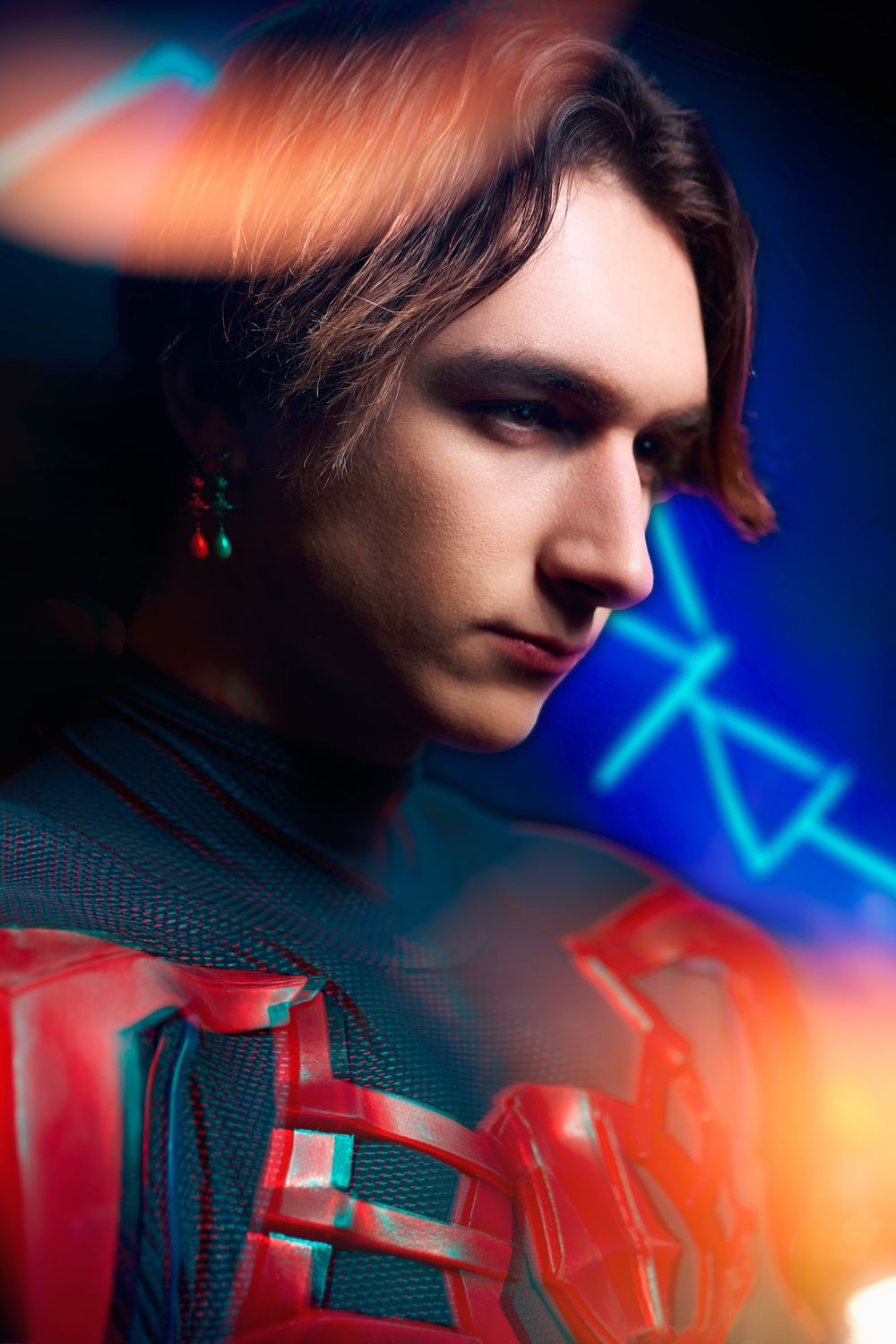 Moody close-up profile shots with dramatic blue and orange lighting effects creating a cinematic atmosphere.