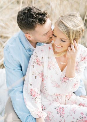 Light and airy film lakeside dock engagement session at Gray's Lake in Des Moines, Iowa