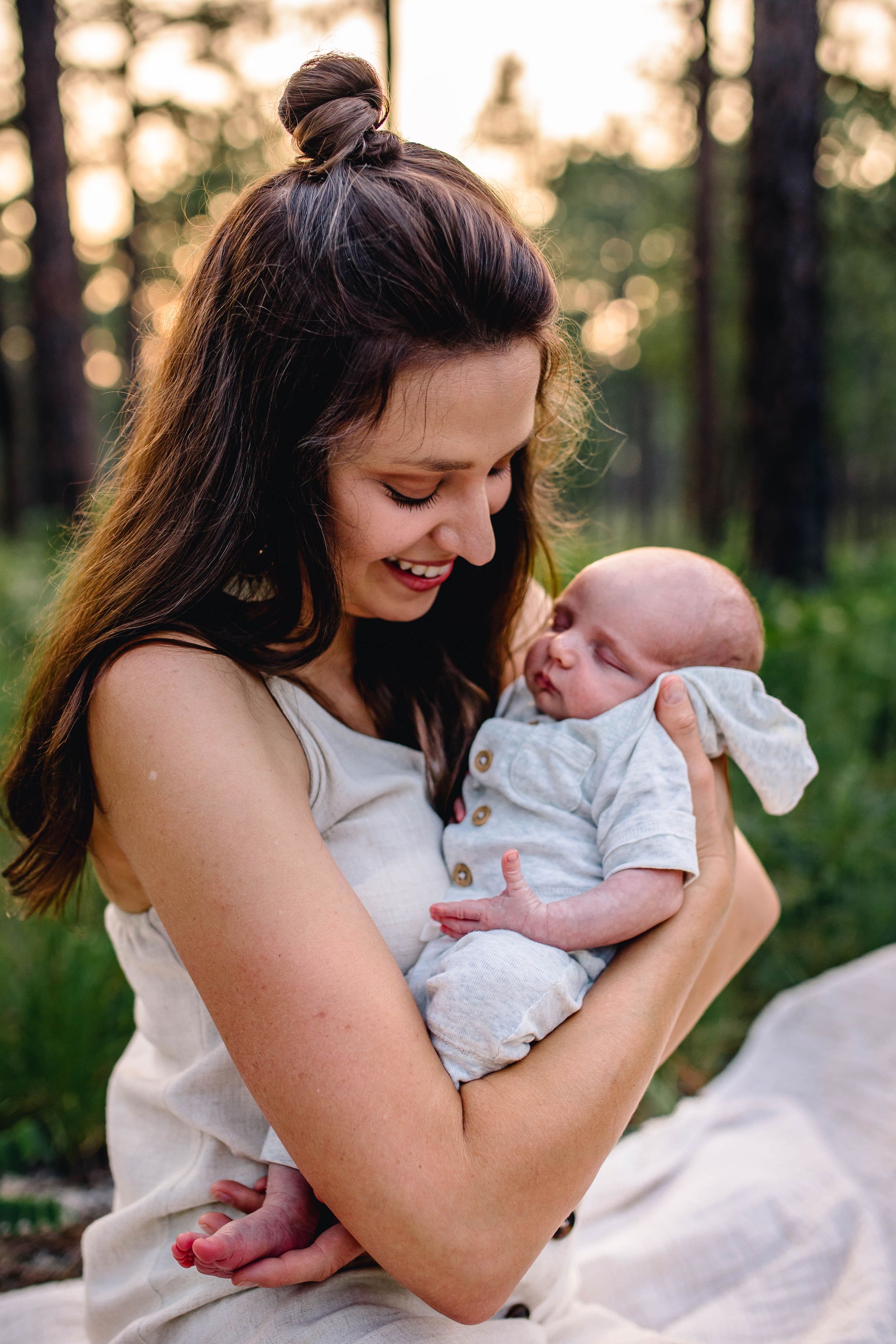 New mother wearing H and M with baby boy wearing Carters Romper