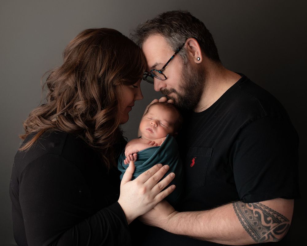 Professional newborn photo with mom and dad
