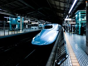 Japanese Shinkansen or bullet-train pulling into station