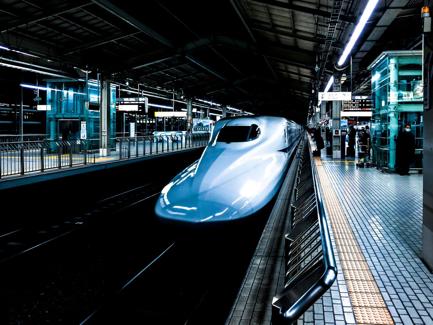 Japanese Shinkansen or bullet-train pulling into station