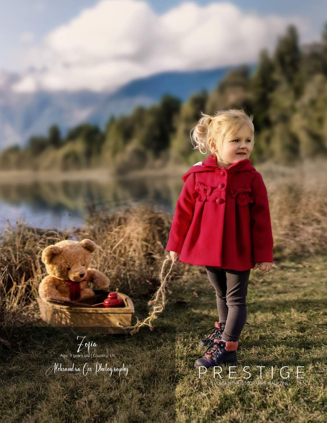 Toddler with teddy bear during portrait session in the park