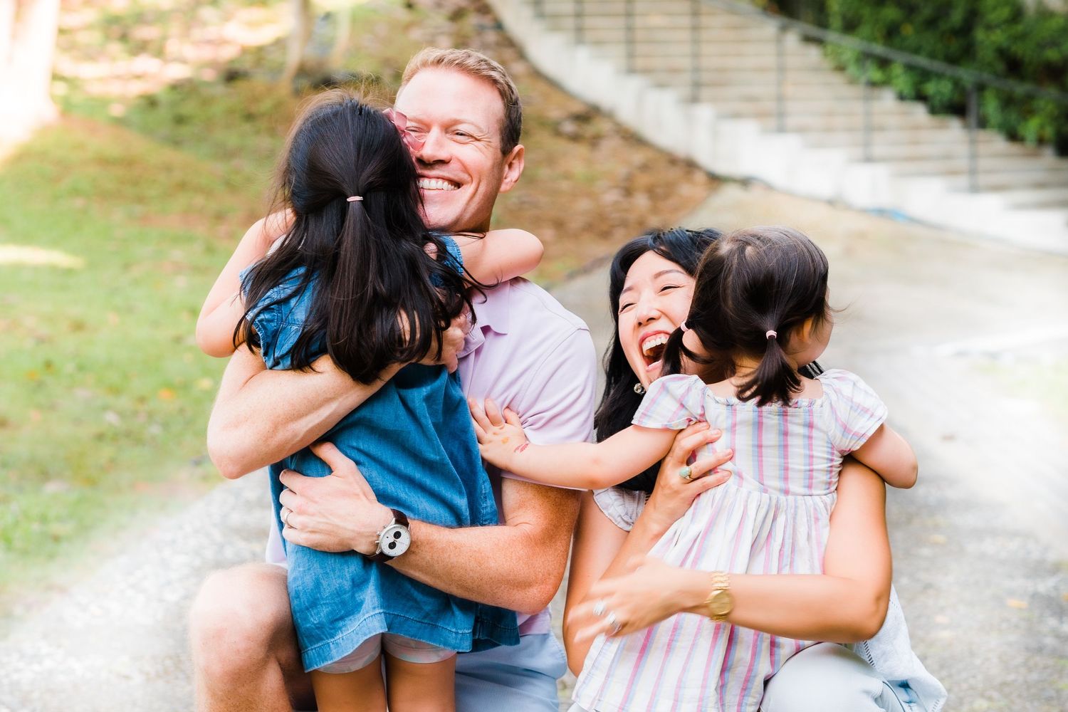 a warm family embrace as kids run towards parents
