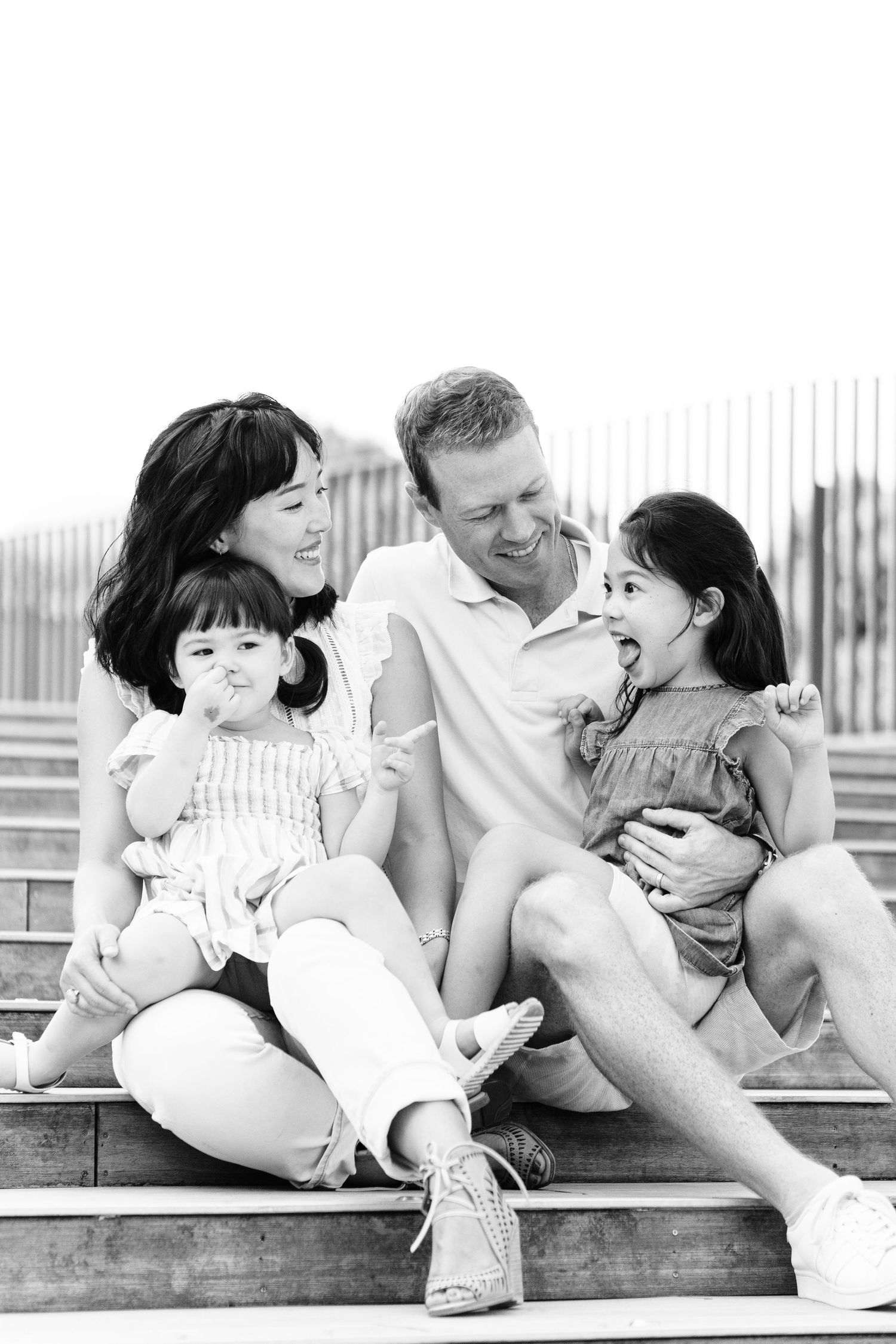 a black and white family portrait with silly faces