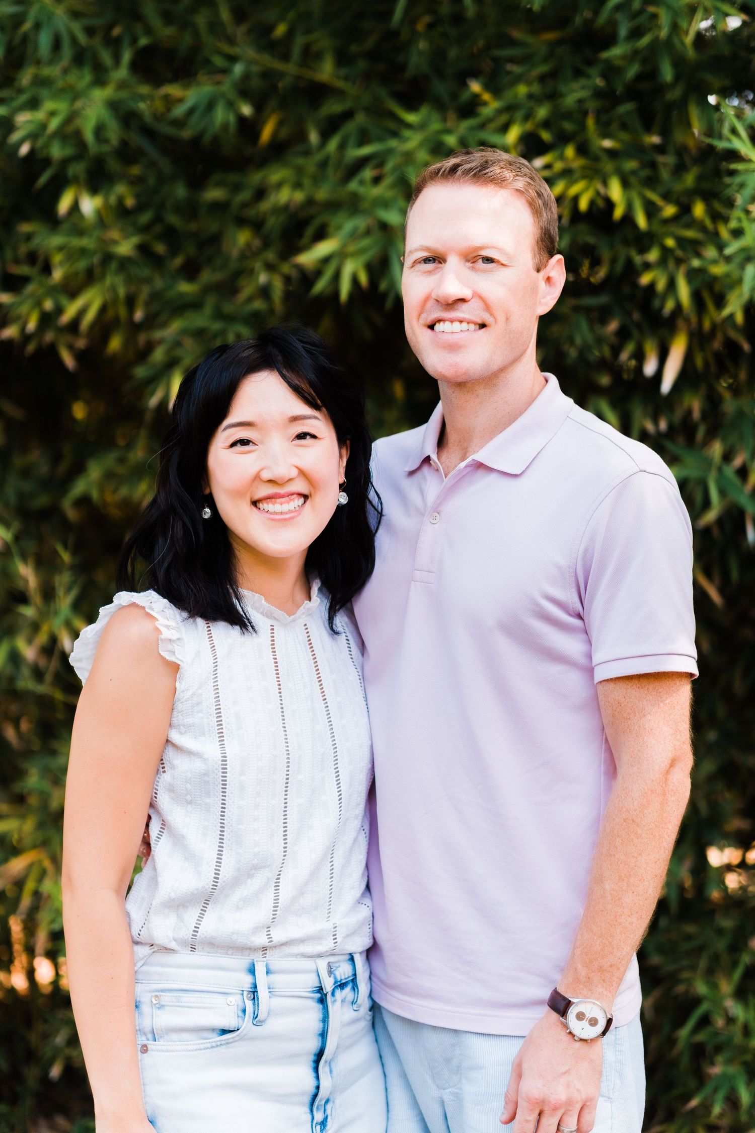 portrait of mom and dad in front of bamboo