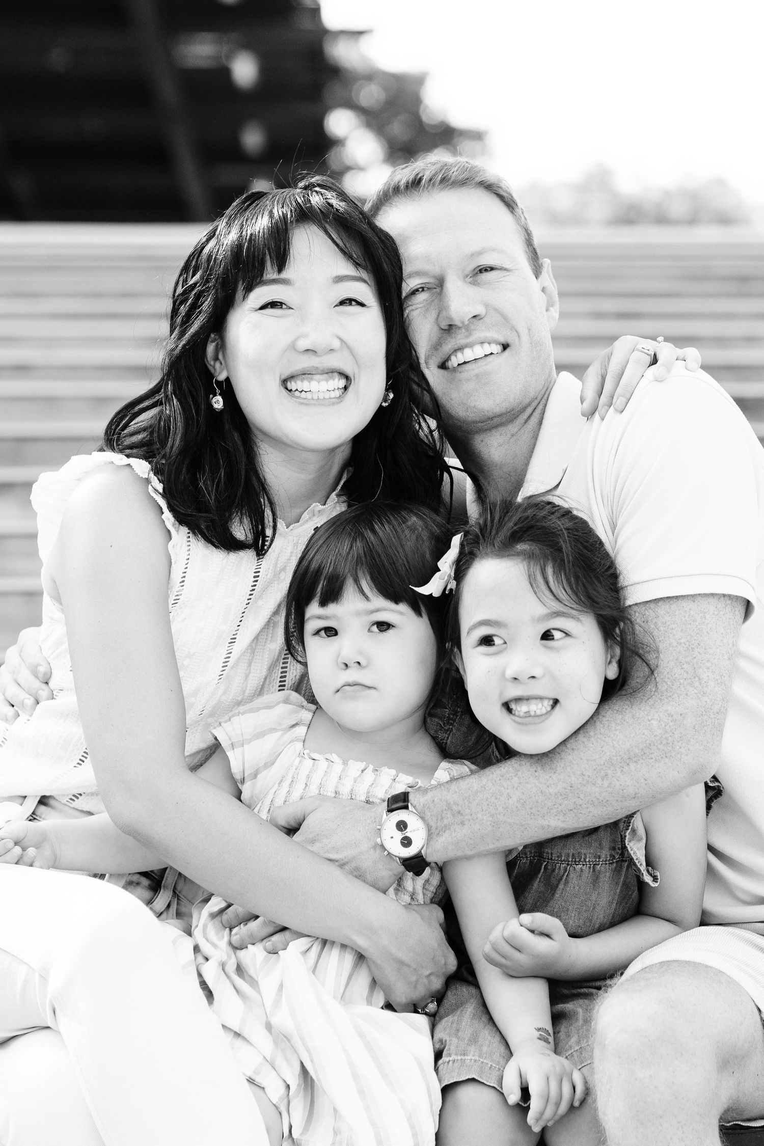 a black and white family portrait with silly faces