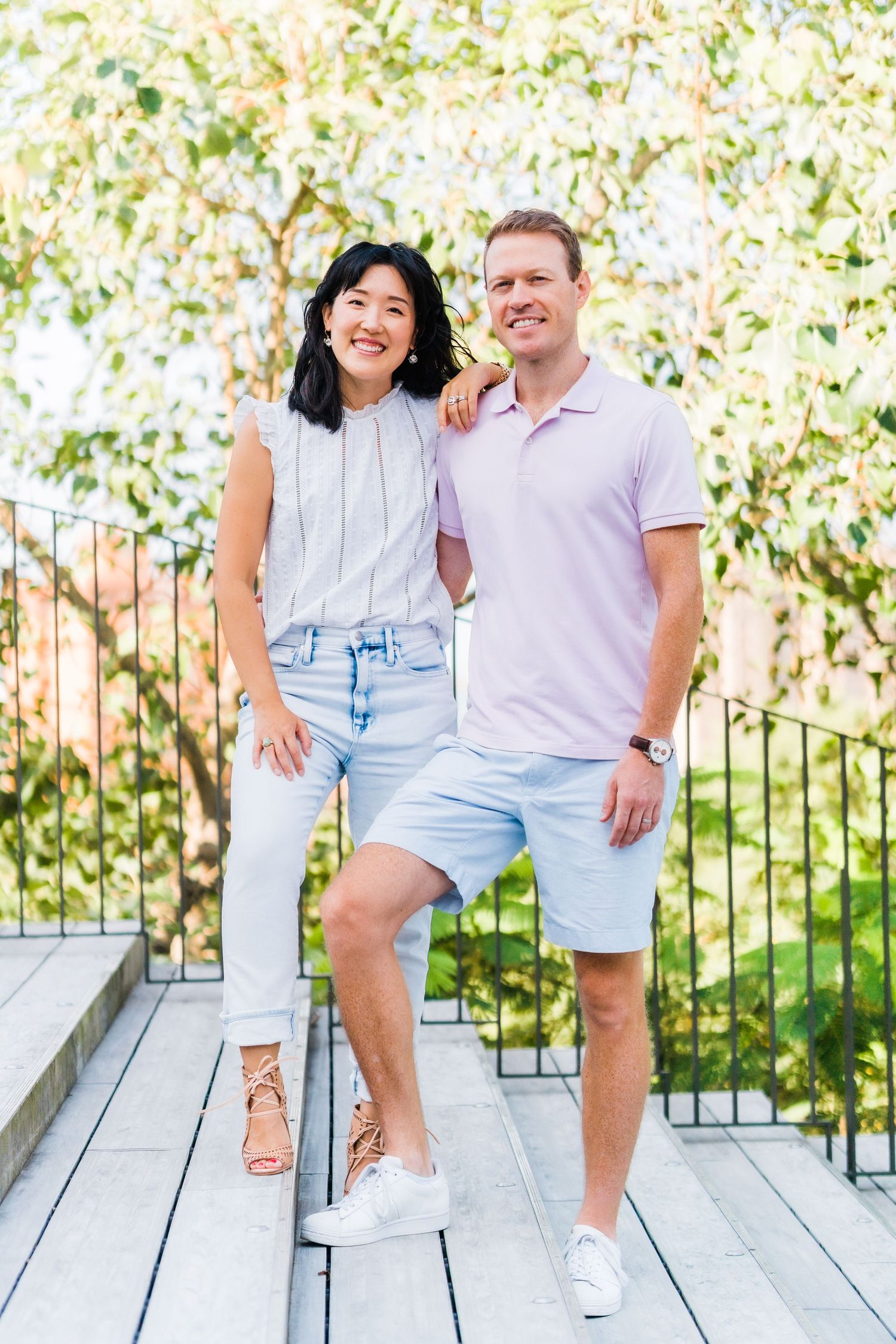 portrait photo of parents with a green-yellow background