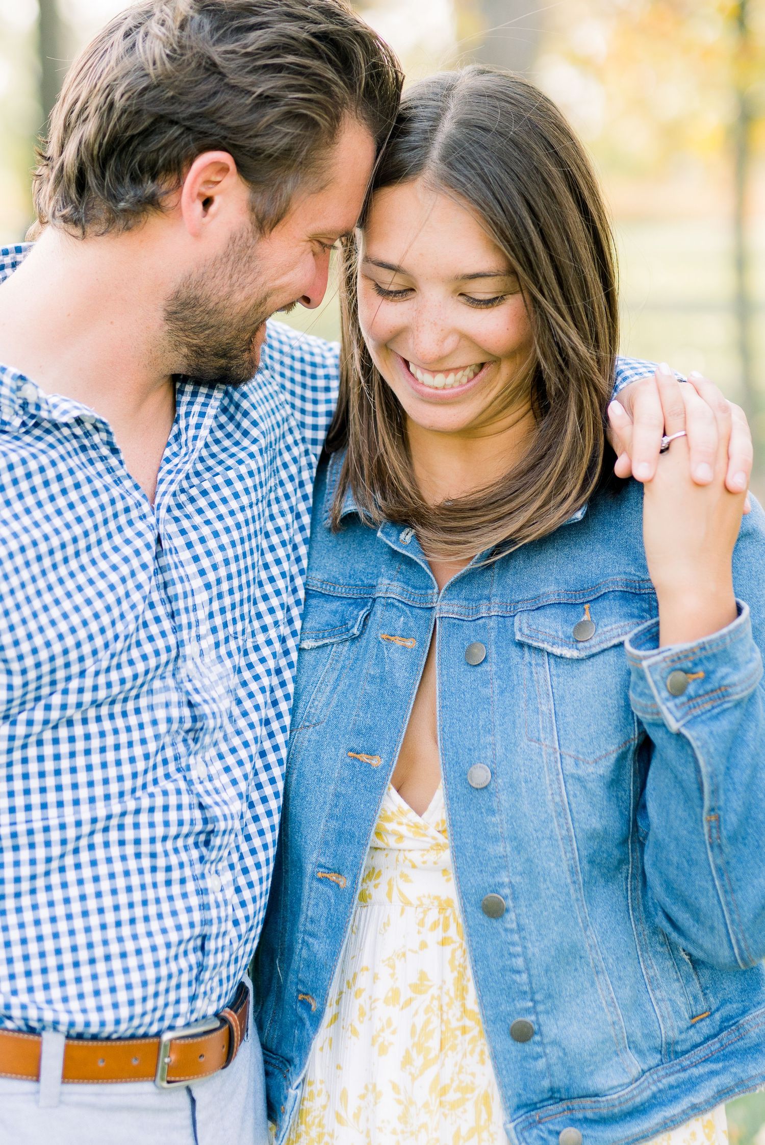 Des Moines Engagement photos at Grays Lake in downtown Des Moines, Iowa with light and airy photographer Nicole Laing