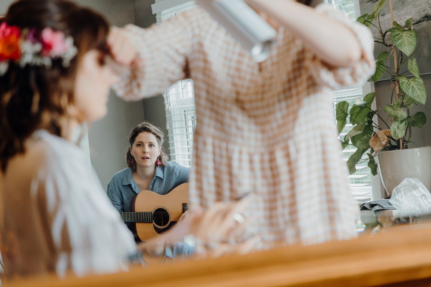Getting ready scene with acoustic guitar and wedding preparations in morning light.