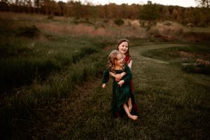 Two girls laughing while walking, one having cerebral palsy. Dover Ohio Photographer