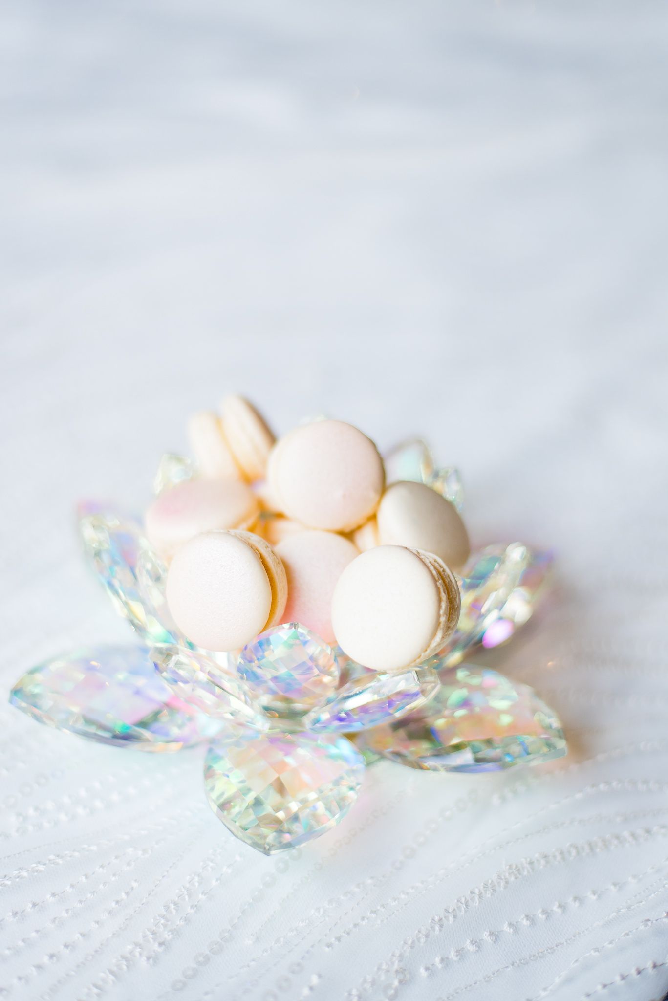 iridescent pale pink macarons in a crystal iridescent bowl