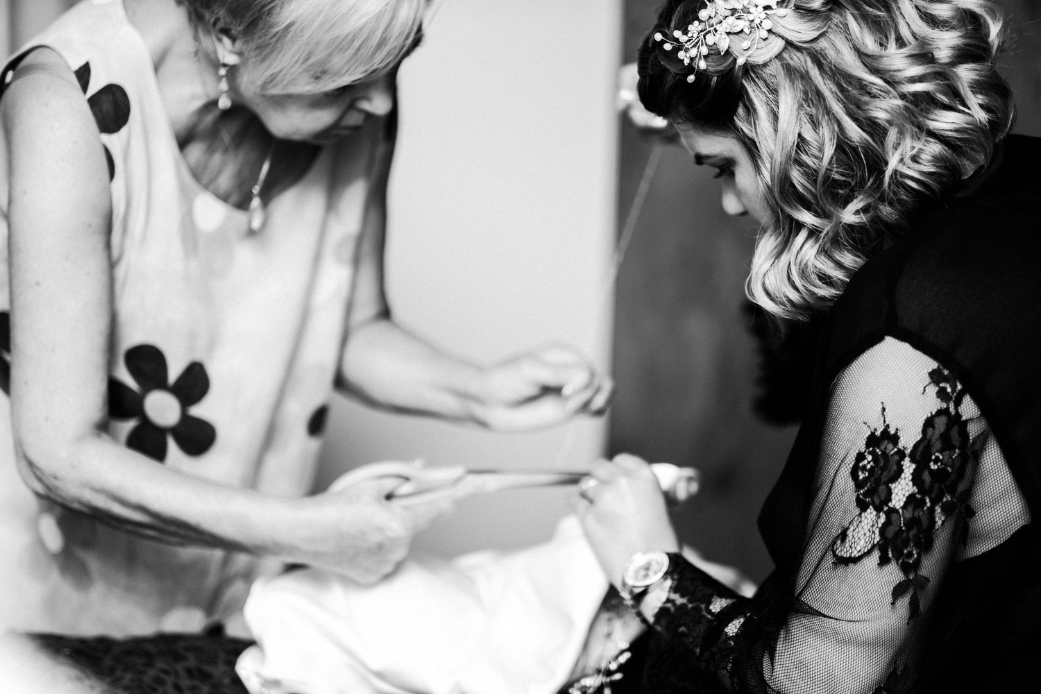 An intimate black and white image of a special pre-wedding moment.