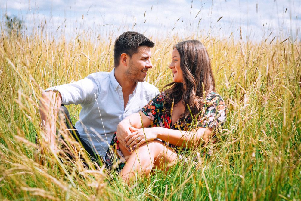Engagement Photography by Zara Davis Photography, near Stroud, Gloucestershire in the Cotswolds sitting long grass