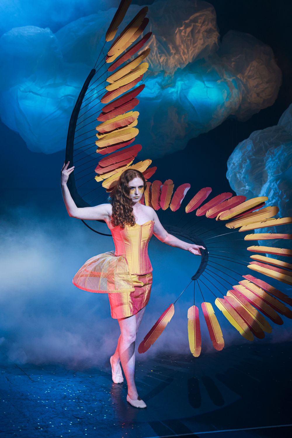 Performer in a colorful costume with large fan-like wings at The Enmore Theatre. © SIX84 Photography, Event Photography