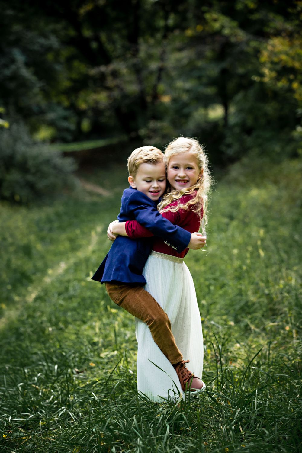 sister picking up brother