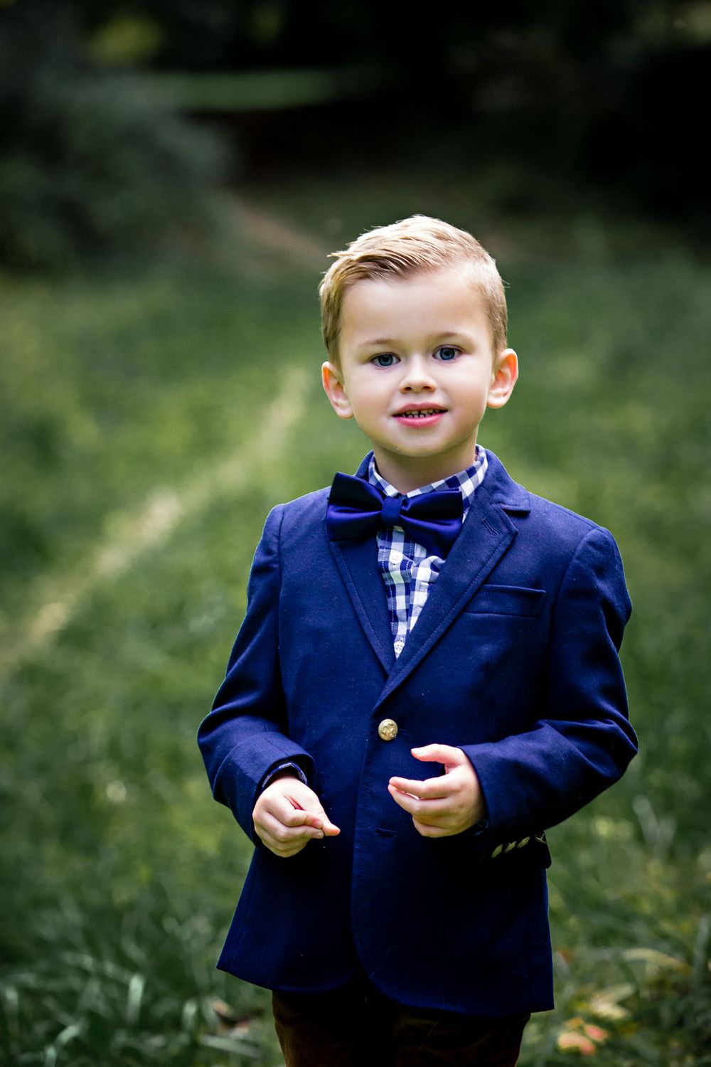 Little boy in blue suit coat