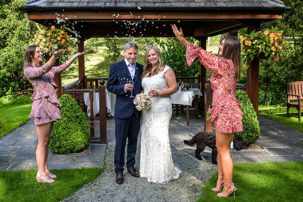 Daughters shower bride and groom with confetti at Briery Wood