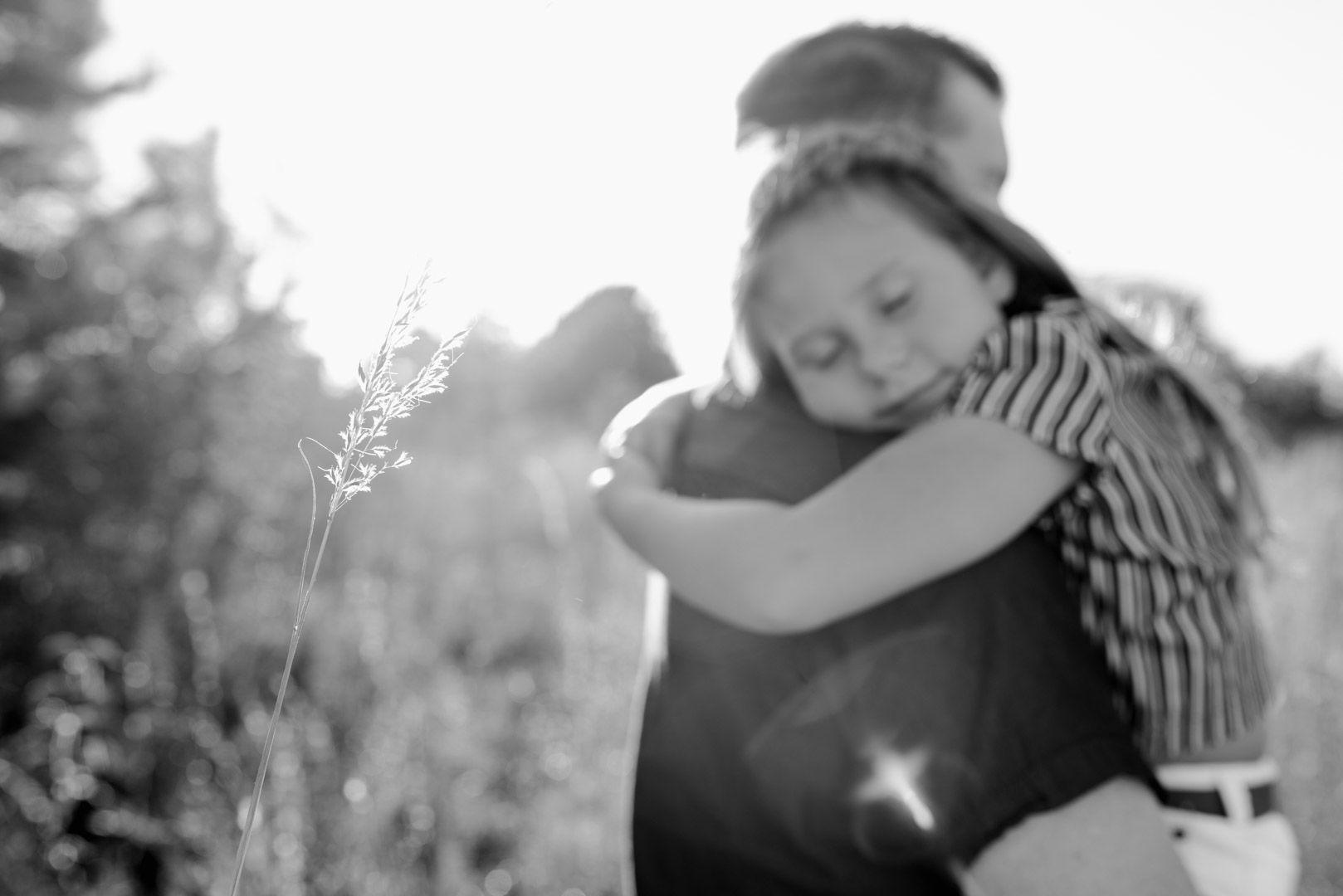 Blog Engagement Family Kansas City Photography Man holding his fiance's daughter