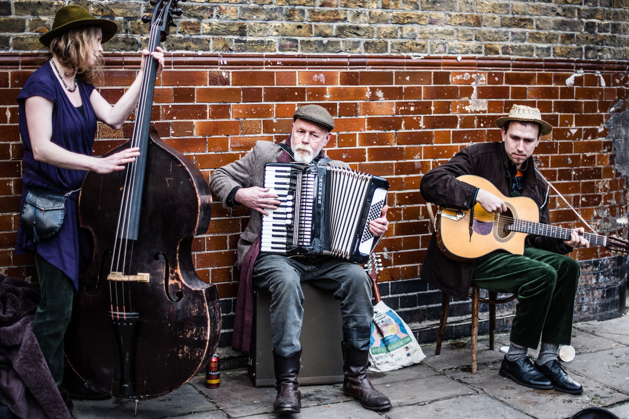 jazz band trio playing at columbia road flower market in London's shoreditch neighborhood