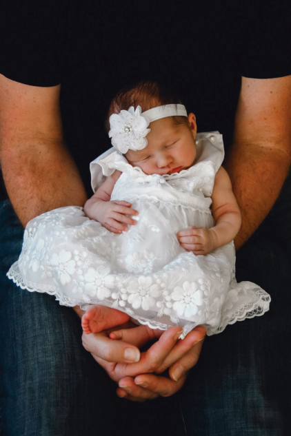 baby in father's arms sutherland shire newborn photography