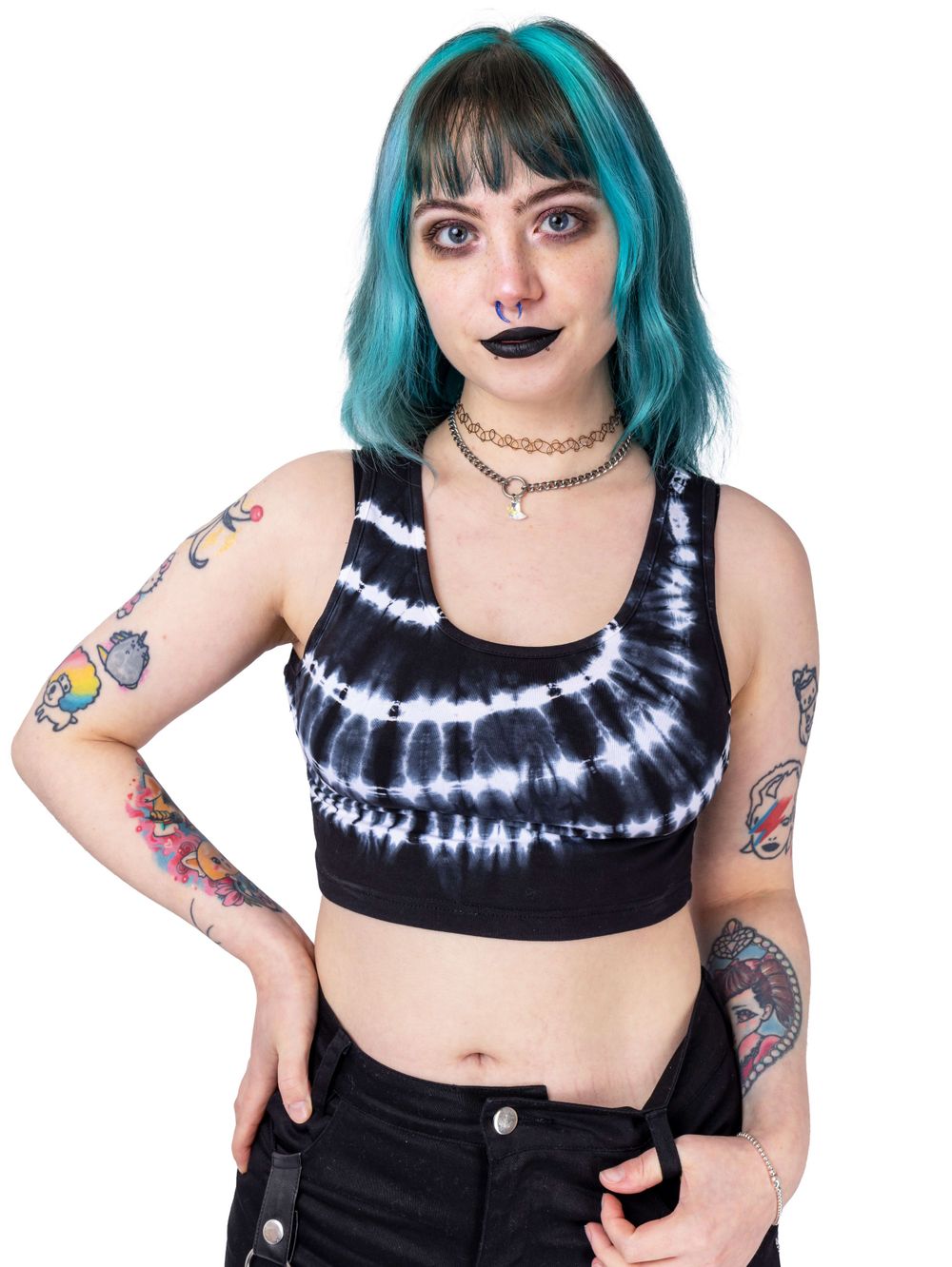 Alternative tattooed white model posing in a photography studio in Shoreham for small goth fashion business.