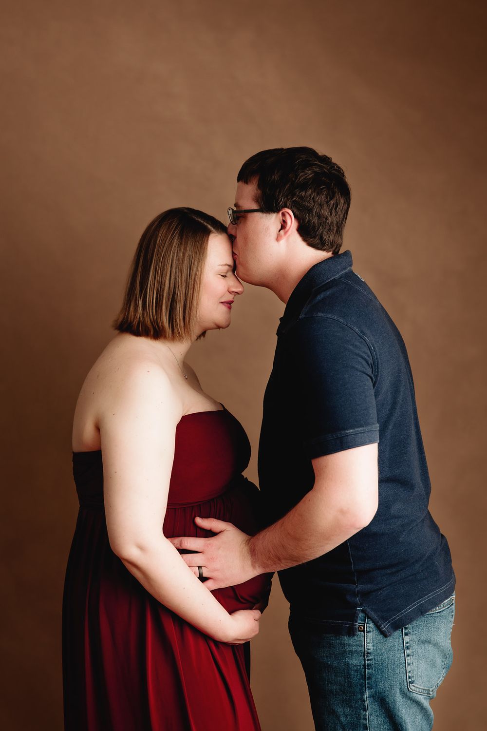 studio maternity session man and expecting mother