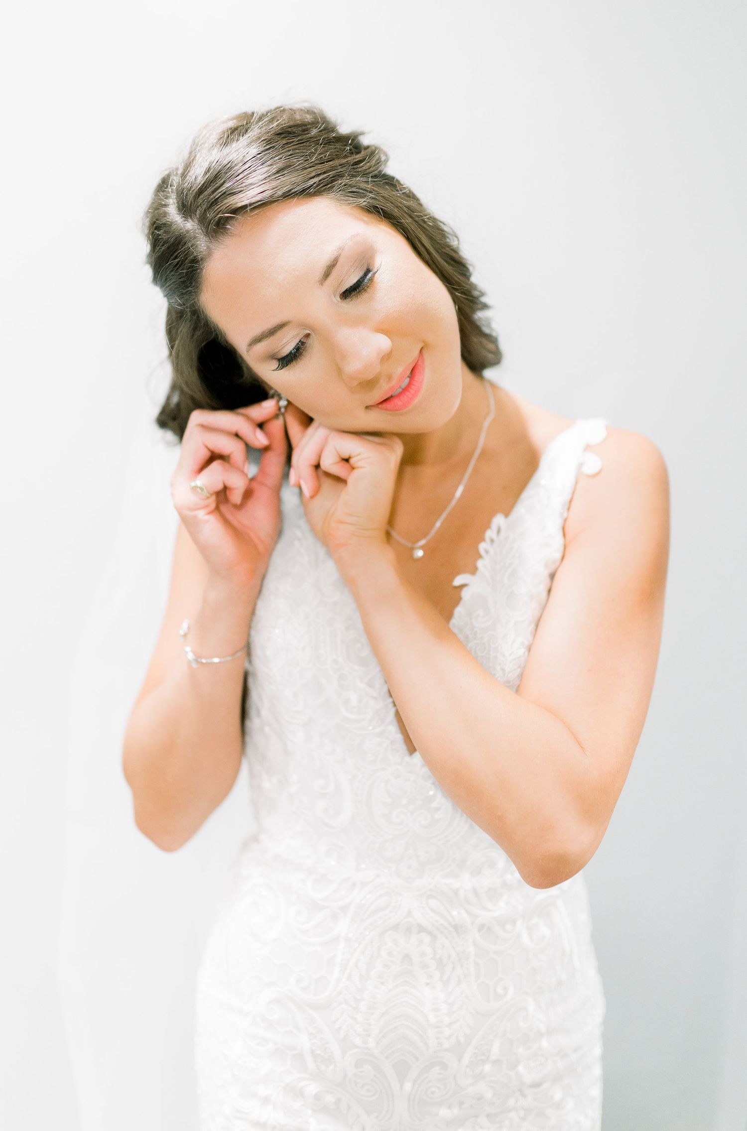 Getting ready dress zipping photos in at Prairie Moon Winery wedding in Ames, Iowa