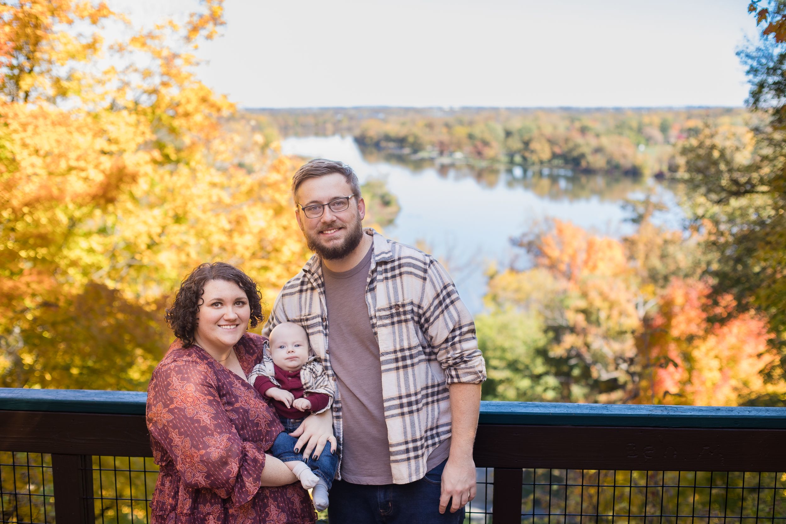 Wedding photographer and family in front of scenic view in Wisconsin.