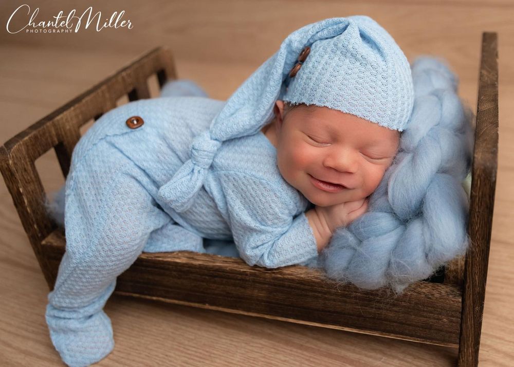 baby boy sleeping smiling