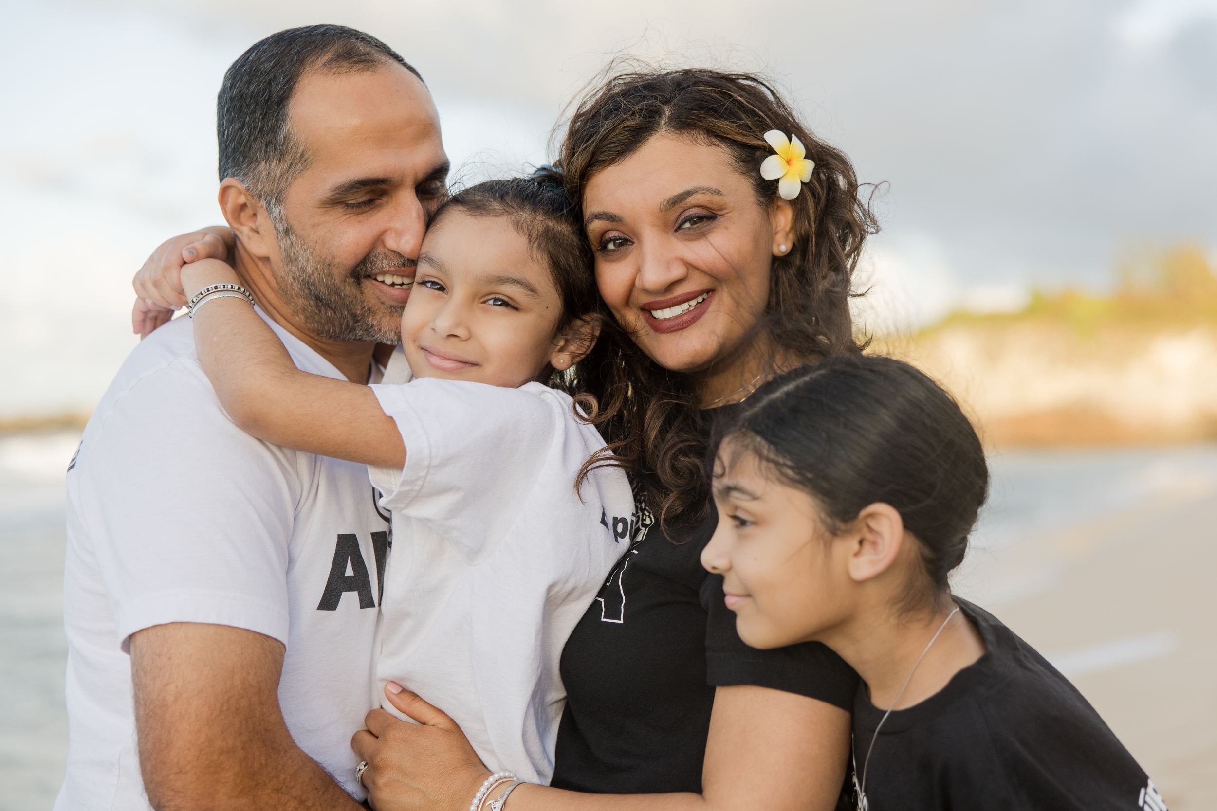 Kaanapali family photographer - parents embrace children during a sunset session