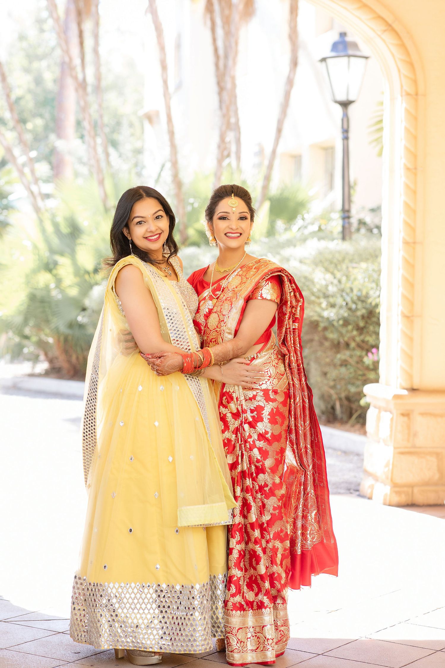 Indian bride with friend in red dress Florida Wedding