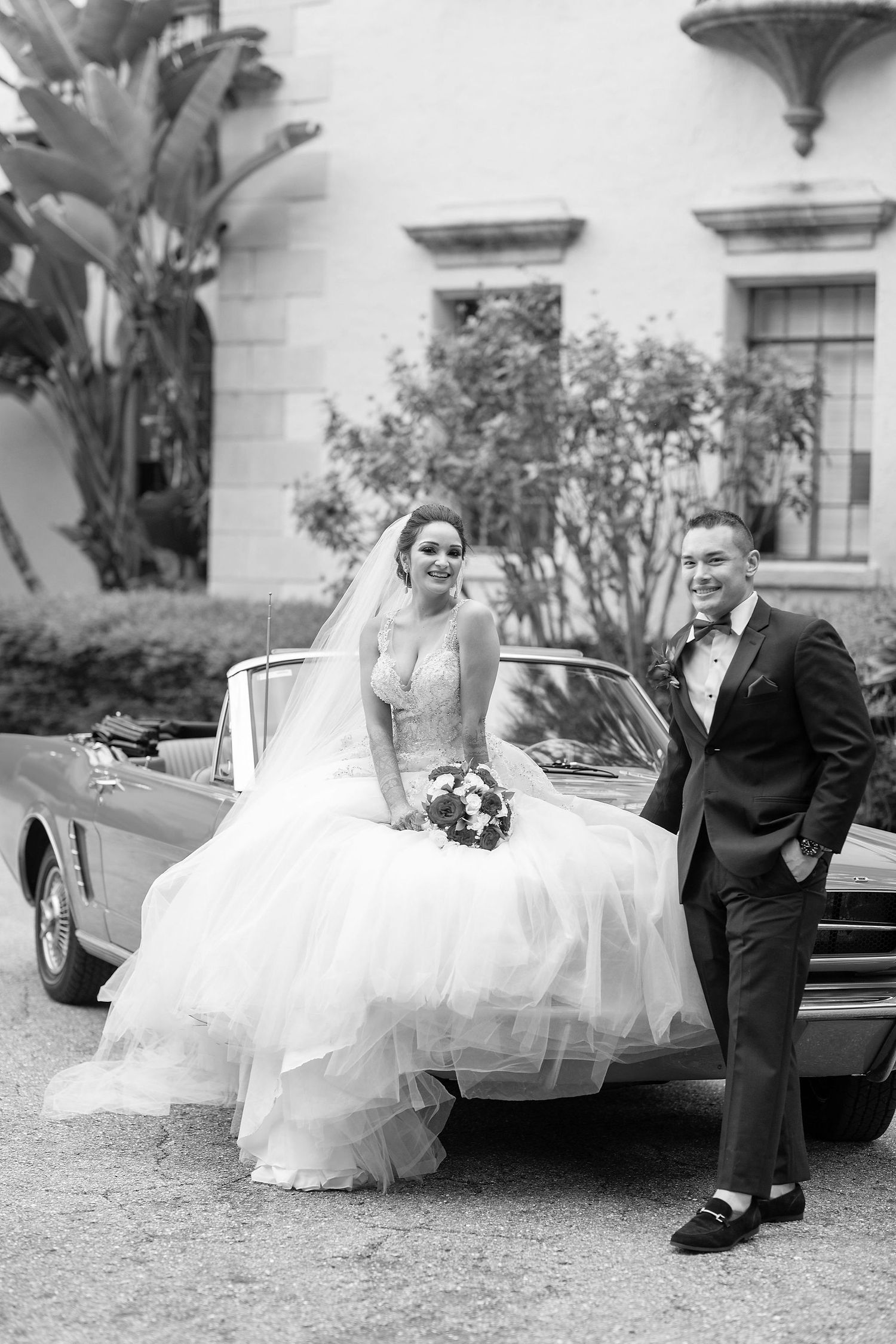 bride with a red car on a background at the Powel Crosley Estate