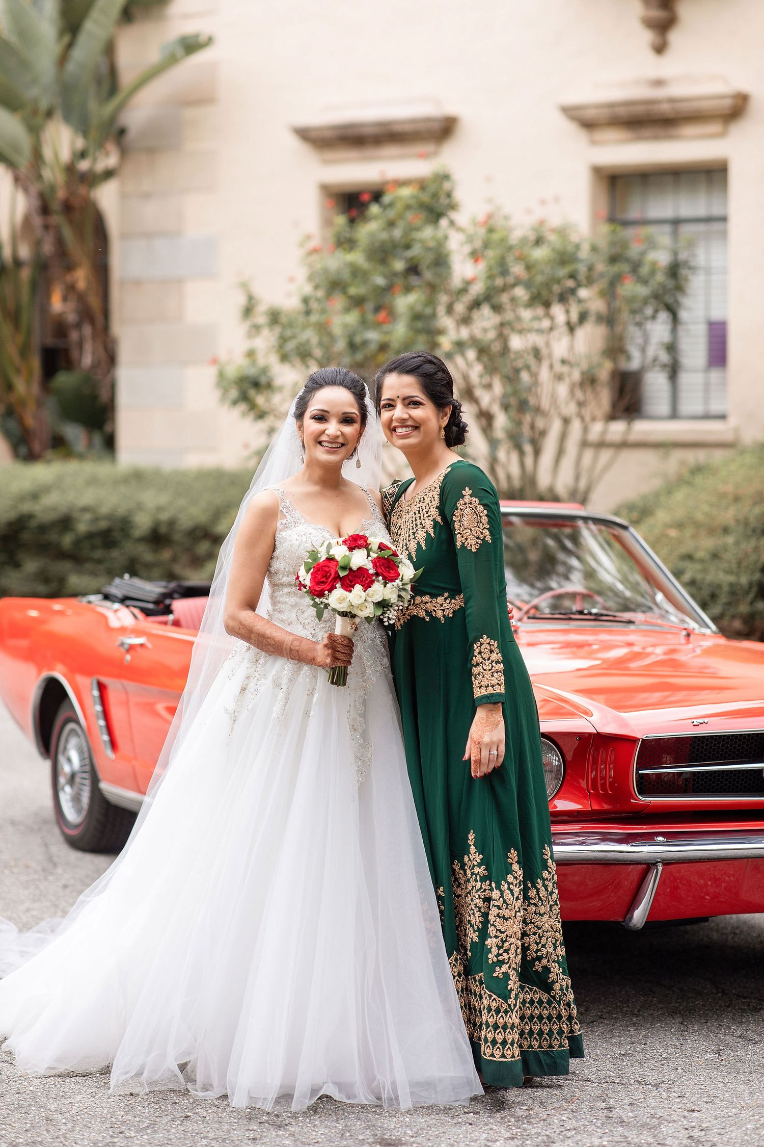bride with a red car on a background at the Powel Crosley Estate