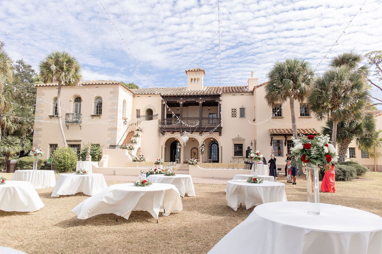 Wide angle view of a garden wedding ceremony at the Powel Crosley Estate Sarasota