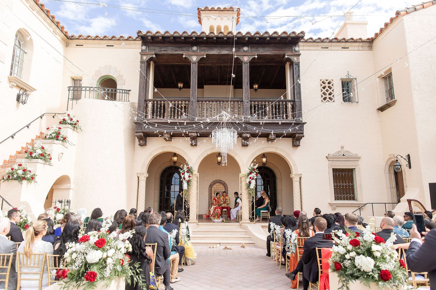Wide angle view of a garden wedding ceremony at the Powel Crosley Estate Sarasota
