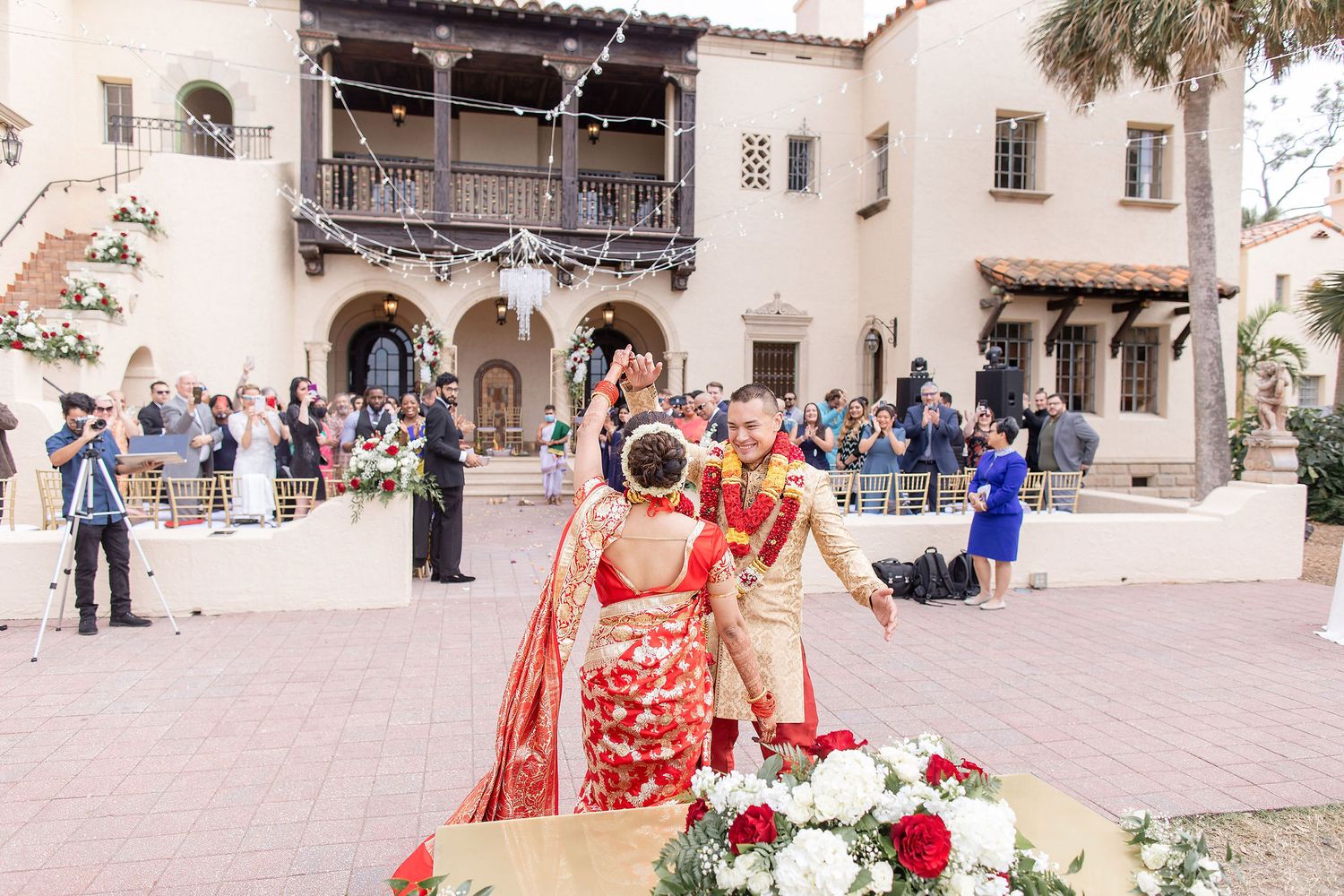 Wide angle view of a garden wedding ceremony at the Powel Crosley Estate Sarasota
