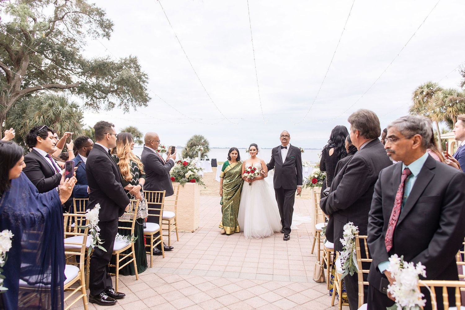 Wide angle view of a garden wedding ceremony at the Powel Crosley Estate Sarasota