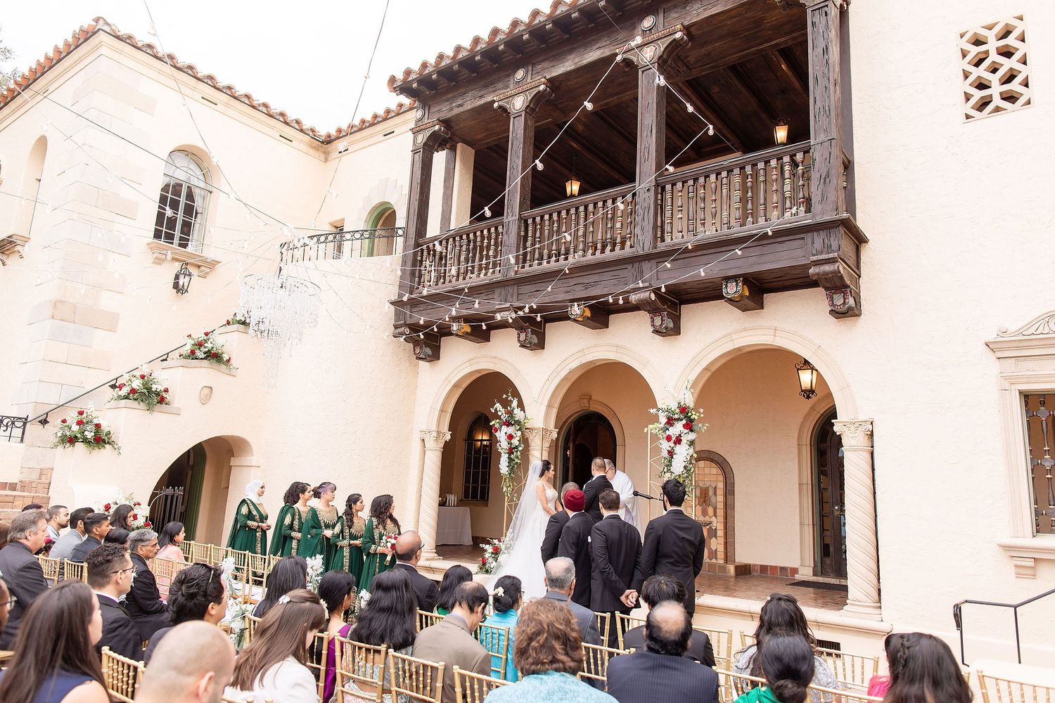 Wide angle view of a garden wedding ceremony at the Powel Crosley Estate Sarasota\