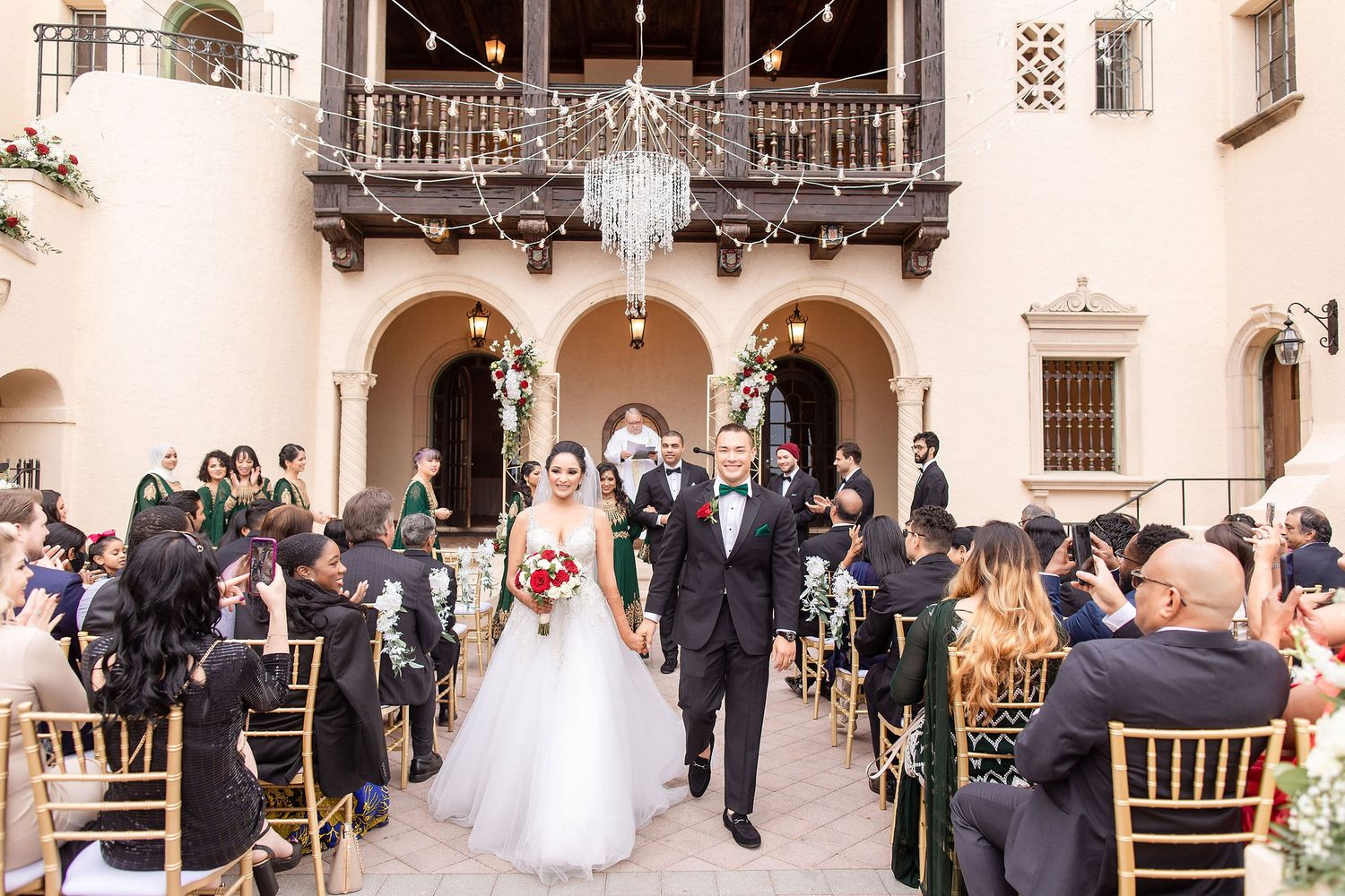 vWide angle view of a garden wedding ceremony at the Powel Crosley Estate Sarasota
