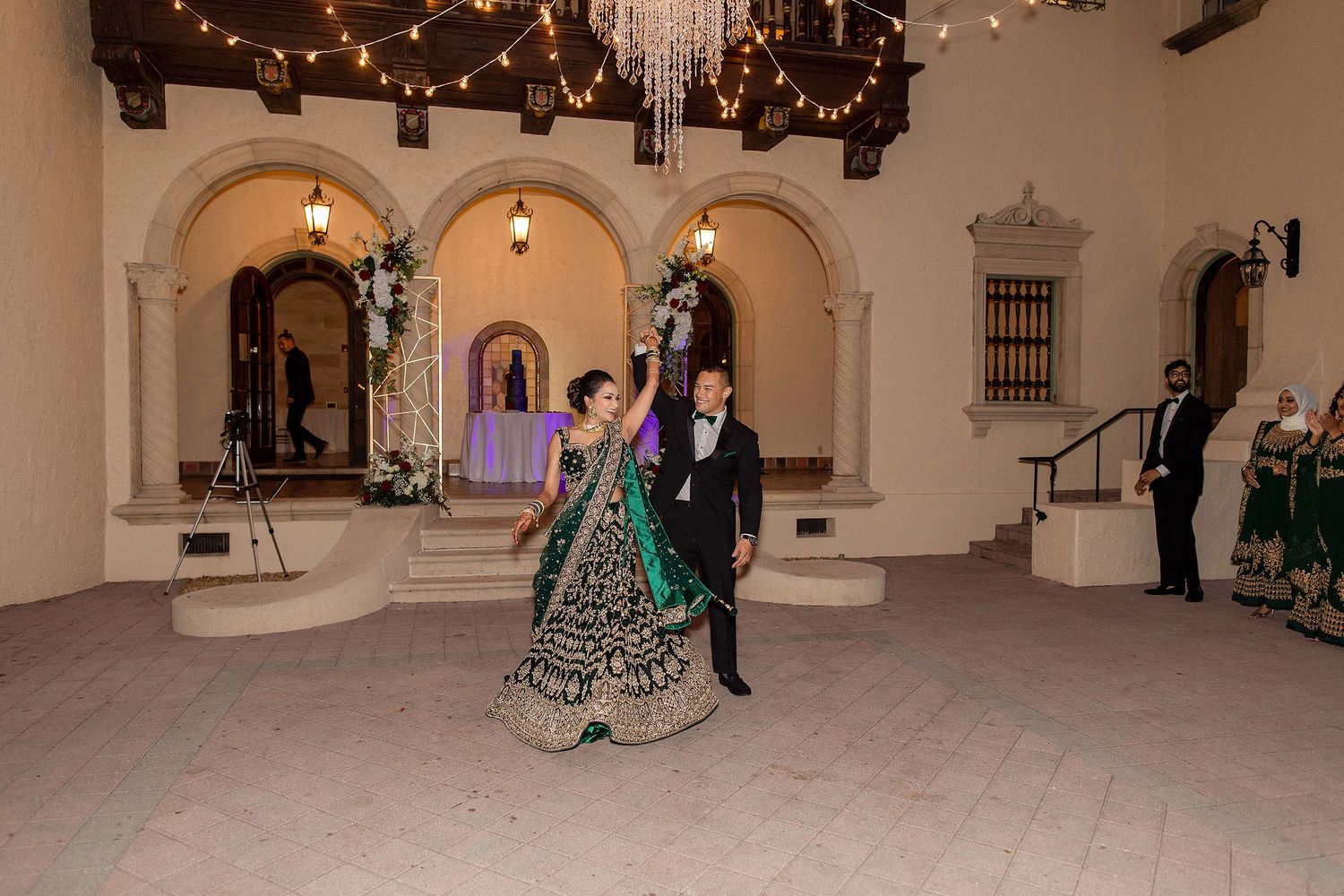 Night portrait of bride and groom on the wedding day with a venue on a background
